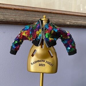 The rainbow sequin jacket belongs to the character Avery Styles from the Rainbow